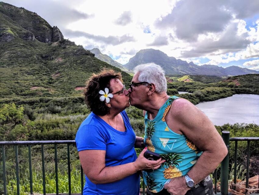 Tourists honeymooners smooching Menhune ponds, Kauai